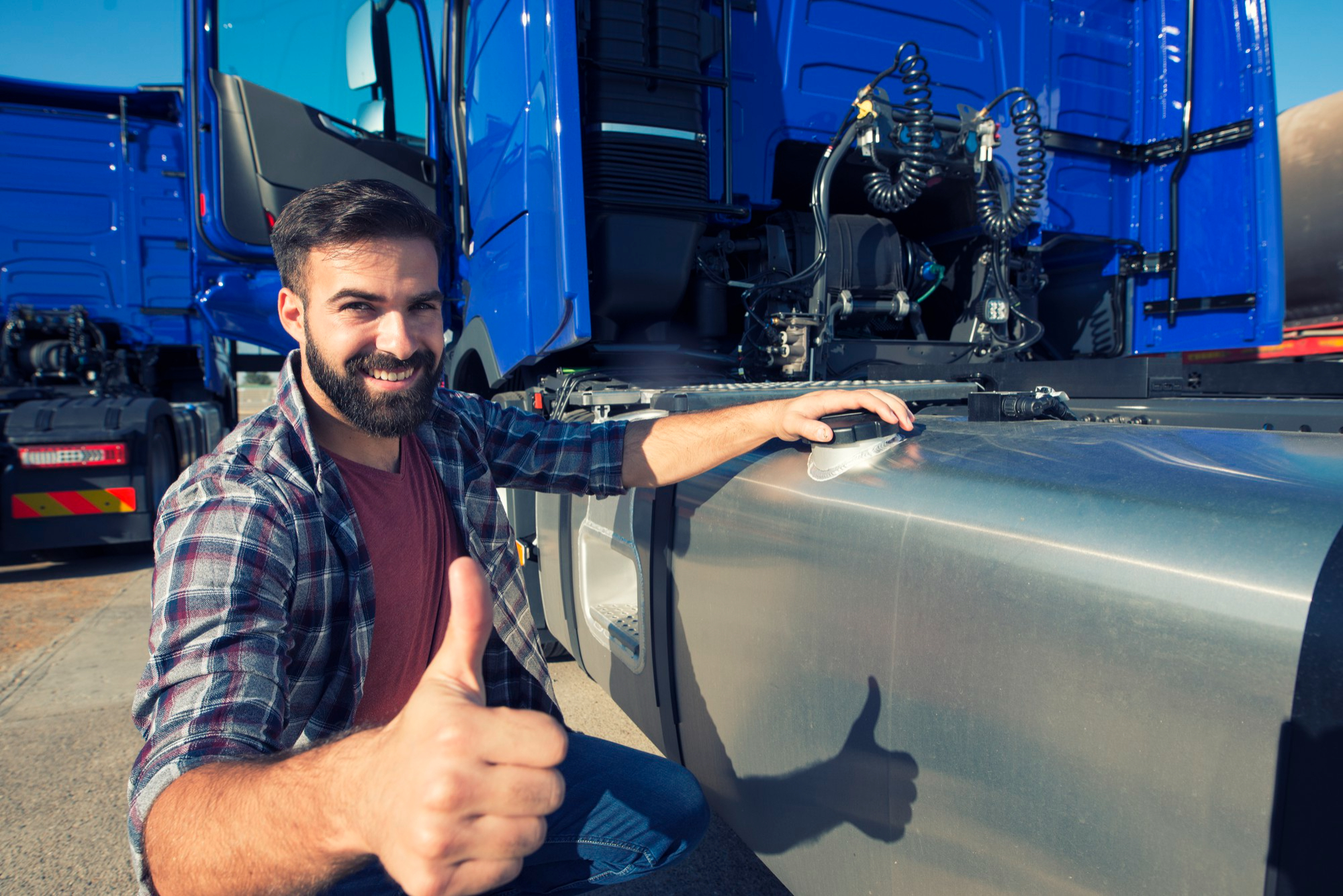 Driver next to a truck